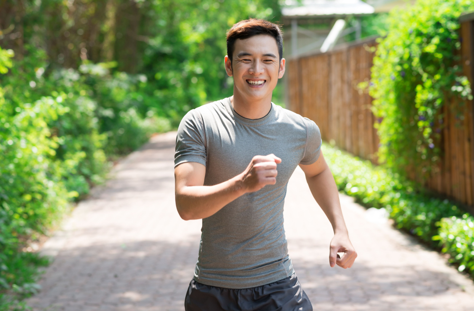 A happy and energetic young man on his morning jog.