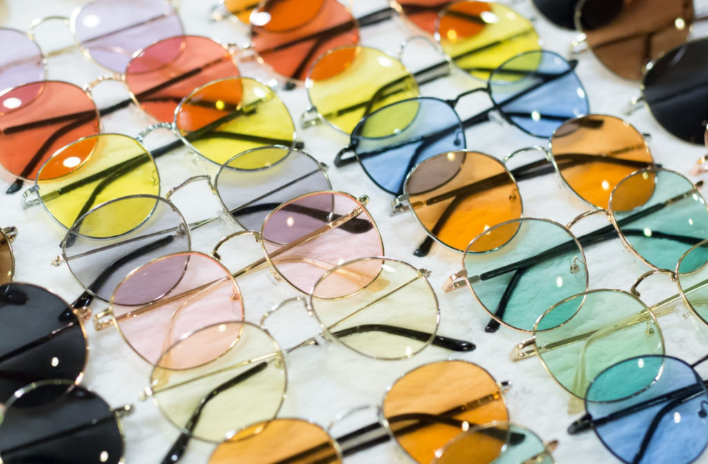 A collection of sunglasses. Each of them in different colours.