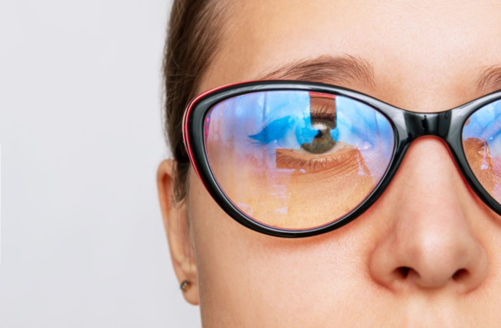 A closeup of someone wearing a pair of blue light prescription glasses.