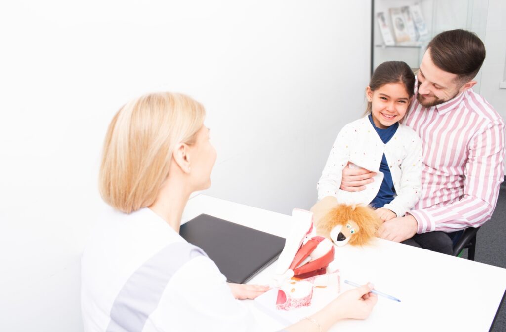 An eye doctor discusses myopia control therapy with a young patient and their parent.