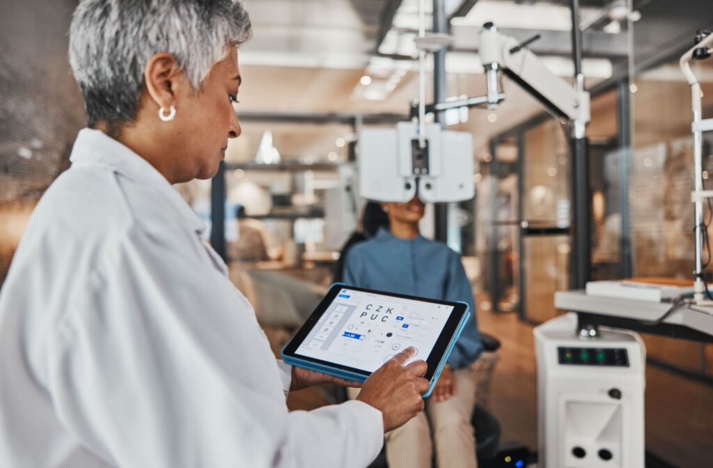 Patient undergoing a comprehensive eye exam to evaluate eligibility for LASIK enhancement