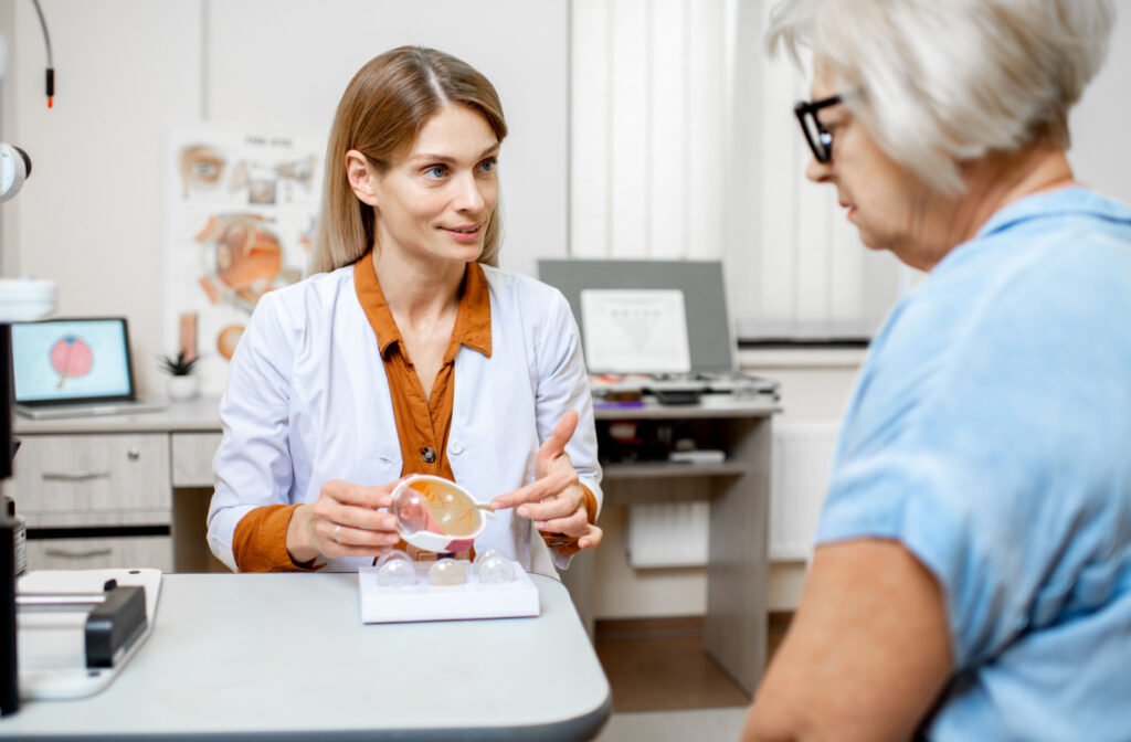 An eye doctor explaining to a patient how diabetes can effect eye health.